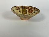 an image of a bowl with a design on it on a white surface
