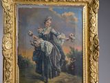 painting of a woman with a basket of flowers in a gold frame