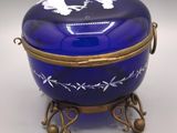 an image of a blue glass box with a gold handle