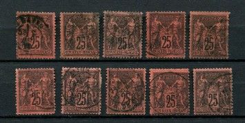 a group of stamps with different designs on them on a black surface