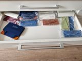 a drawer that has a bunch of items in it