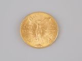 a gold coin with a picture of a woman on it