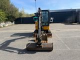 an image of a construction vehicle parked in a parking lot