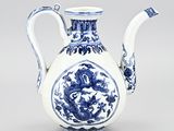 blue and white porcelain teapot with a dragon on the handle
