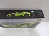 a box with a toy car in it on a table