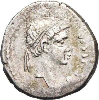 a silver coin with a woman ' s head on it