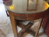 a glass table with candles on it in a living room
