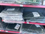 a lot of plastic bags on the shelves in the store