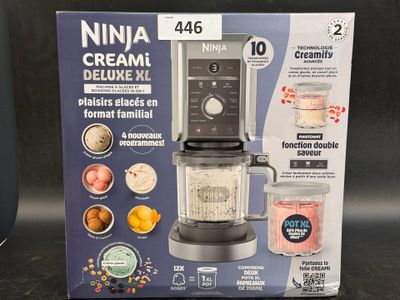 packaging of a blender with a blender in it sitting on a table