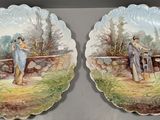 two decorative plates with a painting of a couple on them