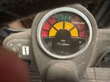 a close up of a speedometer on a motorcycle