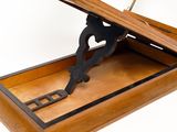 a wooden box that has a metal handle on it