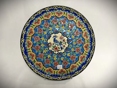 a blue plate with a floral design on it
