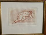 tableau représentant une femme nue allongée sur un lit, dans un cadre doré