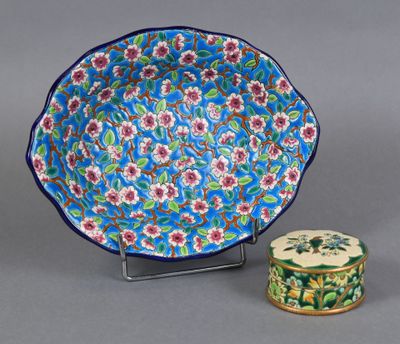 a close up of a plate and a small container on a table