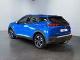 the rear end of a blue suv parked in a garage