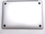 the back of a silver laptop with a white screen and black buttons