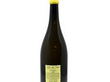 the bottle of wine is empty on a white surface