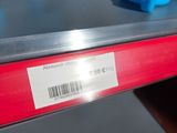 a close up of a shelf with plastic containers on it