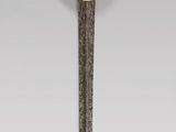 an image of a sword with a gold handle on a gray background