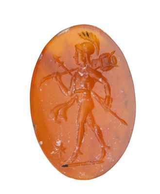 an image of a carved orange agate with a man holding a sword