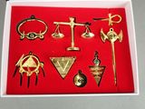 a box with a variety of gold items in it