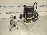 a close up of a machine on a table next to a pair of tools