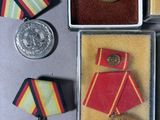 several medals and medals are in a box on a table