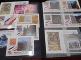 a suitcase full of stamps on display on the table