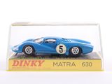 a blue model of a racing car in a glass case