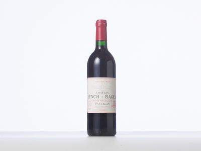 a close up of a bottle of red wine on a table