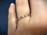 a close up of a person ' s hand with a ring on their finger