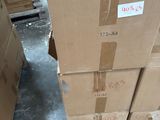 a stack of boxes sitting on a pallet in a warehouse