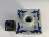 a small blue and white candle holder and a small blue and white candle holder