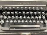 an old typewriter sitting on top of a table