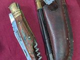 three different types of knives on a red cloth