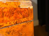 a close up of a piece of wood on a table