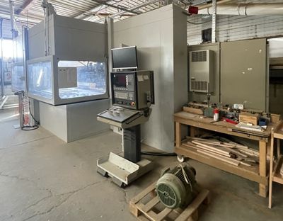 an image of a room with a tv and a workbench