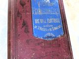an old book with a blue cover on a table