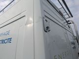 a white van with a blue and white logo on it
