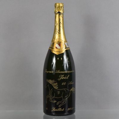 a close up of a bottle of champagne on a table