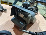 a sander on a table with other tools on the table