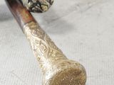 a close up of a baseball bat and a ball on a table