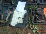 many different tools in the case on the ground