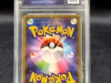 a close up of a pokemon trading card in a clear case