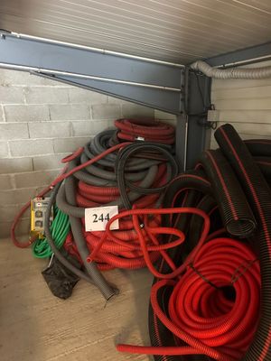 a pile of hoses and hoses in a garage