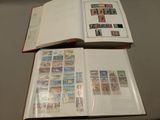 a book with stamps on it sitting on a table