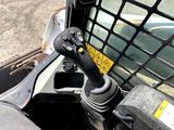 a close up view of a car ' s dashboard with a steering control