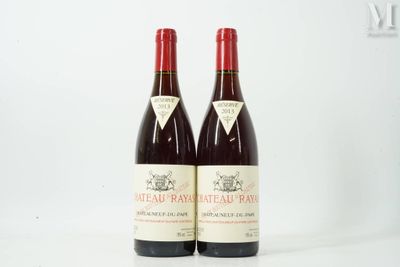 two bottles of wine sitting next to each other on a white surface