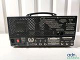 a close up of a black amplifier sitting on top of a table